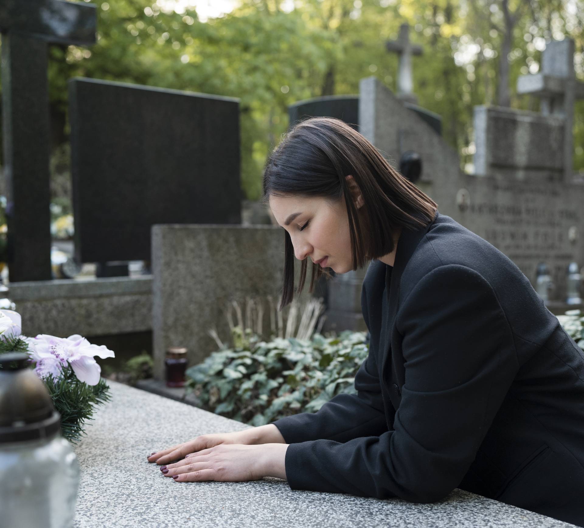 woman-mourning-cemetery-grave